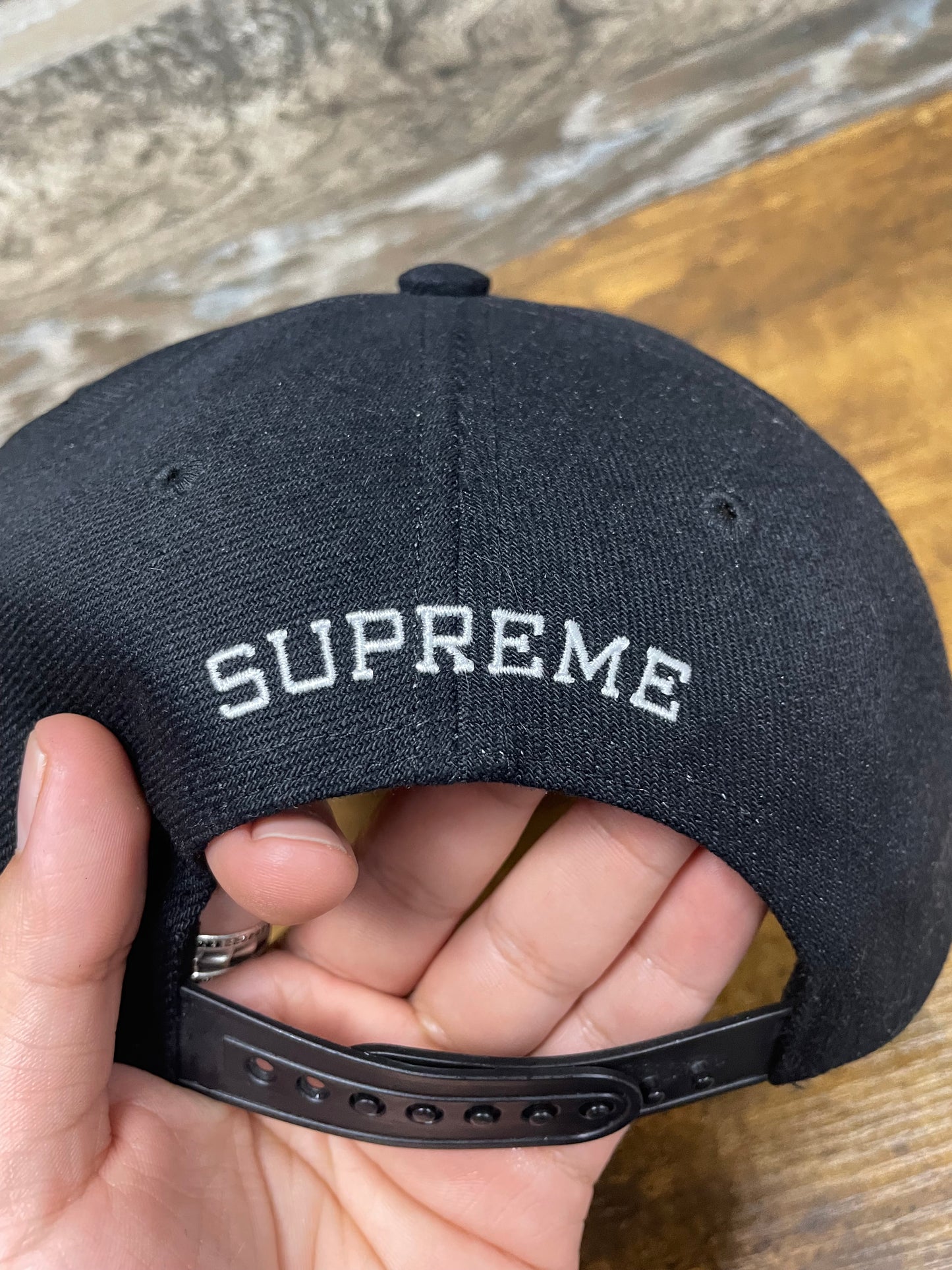 OS - Supreme Script Logo 6-Panel hat in black from the SS24 season