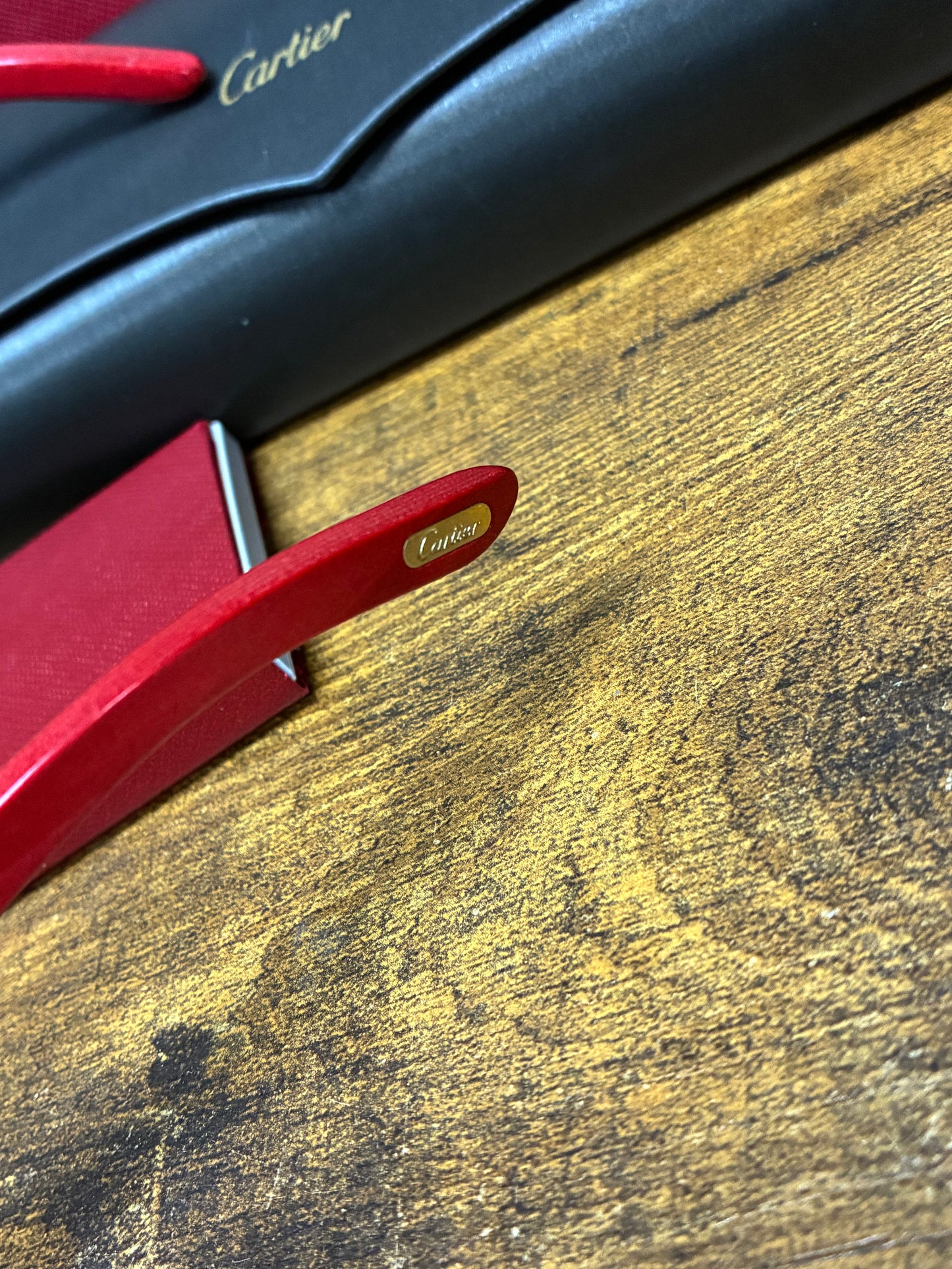 Cartier Rimless Diamond-Cut Red Buffalo Horn Big C Décor Sunglasses